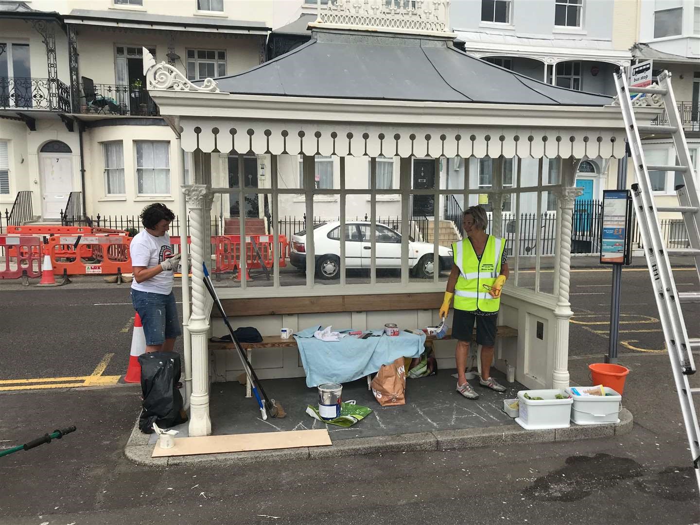 Volunteers cleaning and repainting shelter on Ramsgate seafront